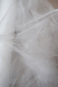 Load image into Gallery viewer, Ivory Shiny Mesh Fabric by the Yard | Ivory Fabric for Wedding Dresses & Festivals | Perfect for Every Occasion.