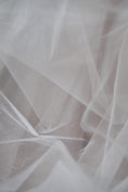 Load image into Gallery viewer, Ivory Shiny Mesh Fabric by the Yard | Ivory Fabric for Wedding Dresses & Festivals | Perfect for Every Occasion.