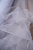 Load image into Gallery viewer, White Shiny Mesh Fabric by the Yard - Shiny Bridal Fabric & Festival Material for Weddings and Special Occasions, Costumes, Prom Dresses
